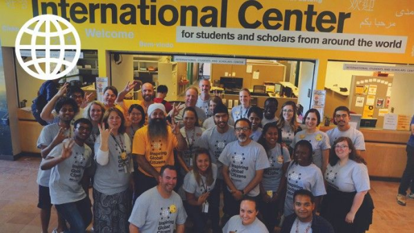 Group of staff and students in front of the International Students and Scholars Center.